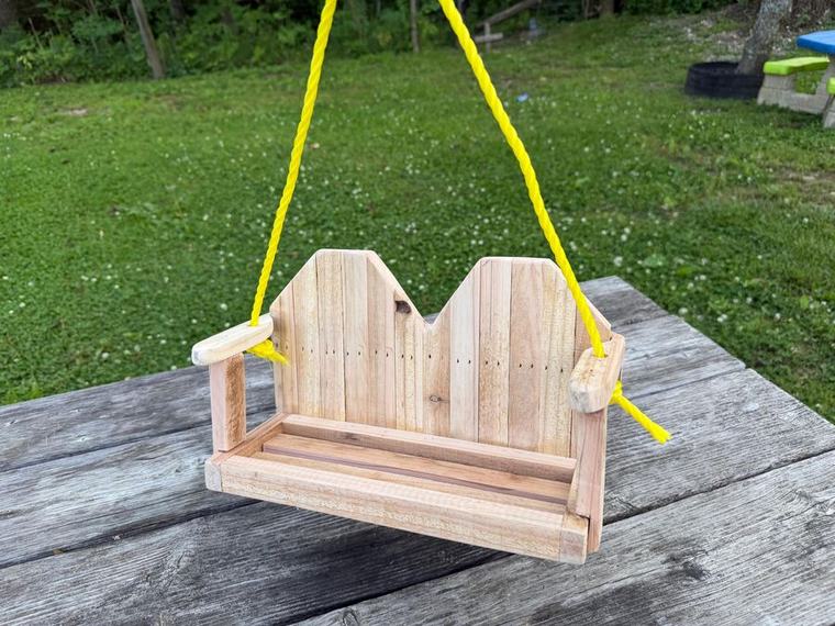 Miniature cedar loveseat swing.
