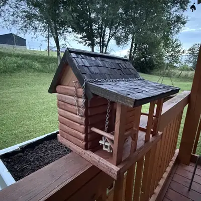 Log-cabin birdhouse with a hand-shingled roof