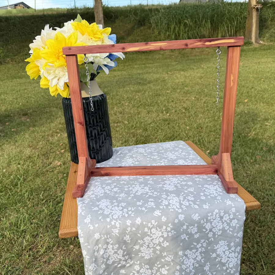 Red cedar A-frame mini swing stand shown on its own with hanging chains and no swing